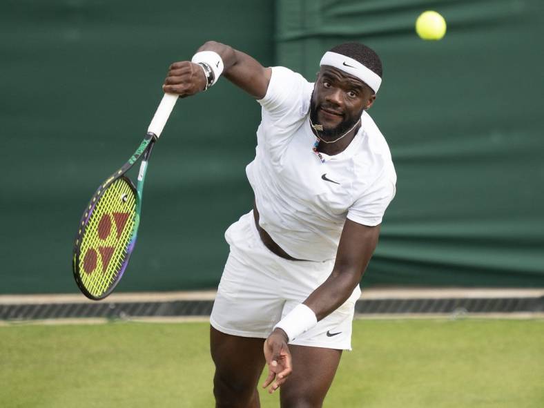 Jul 3, 2022; London, United Kingdom; Frances Tiafoe (USA) serves the ball during his match against David Goffin (BEL) on day seven at All England Lawn Tennis and Croquet Club. Mandatory Credit: Susan Mullane-USA TODAY Sports