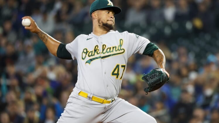Jul 3, 2022; Seattle, Washington, USA; Oakland Athletics starting pitcher Frankie Montas (47) throws against the Seattle Mariners during the first inning at T-Mobile Park. Mandatory Credit: Joe Nicholson-USA TODAY Sports