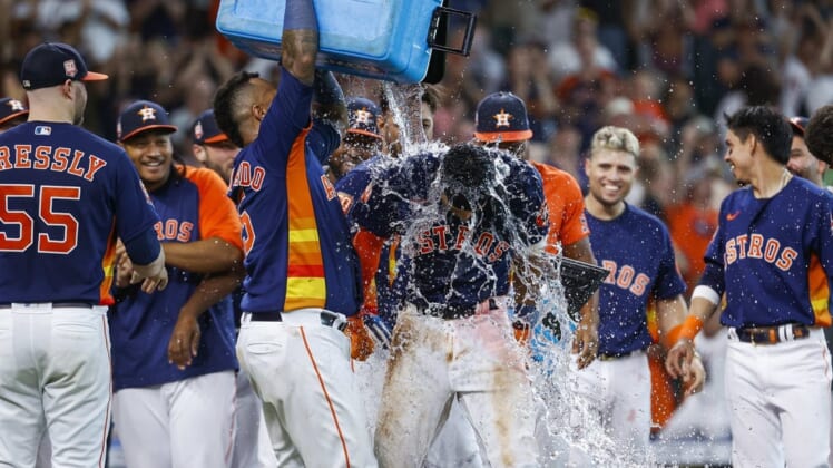 Jul 3, 2022; Houston, Texas, USA; Houston Astros shortstop Jeremy Pena (3) has water poured on his head by catcher Martin Maldonado (15) after hitting a walk-off home run during the ninth inning against the Los Angeles Angels at Minute Maid Park. Mandatory Credit: Troy Taormina-USA TODAY Sports