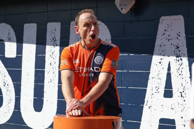 Jul 3, 2022; New York, New York, USA; American competitive eater Joey Chestnut ignited the smoke stacks
before the game between New York City FC and Atlanta United at Yankee Stadium. Mandatory Credit: Vincent Carchietta-USA TODAY Sports