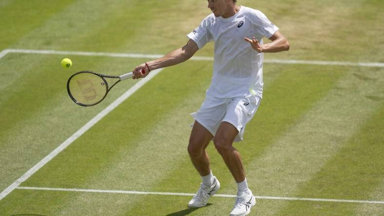 Jul 4, 2022; London, United Kingdom; Alex De Minaur (AUS) returns a shot during his match against Cristian Garin (CHI) on day eight at All England Lawn Tennis and Croquet Club. Mandatory Credit: Susan Mullane-USA TODAY Sports