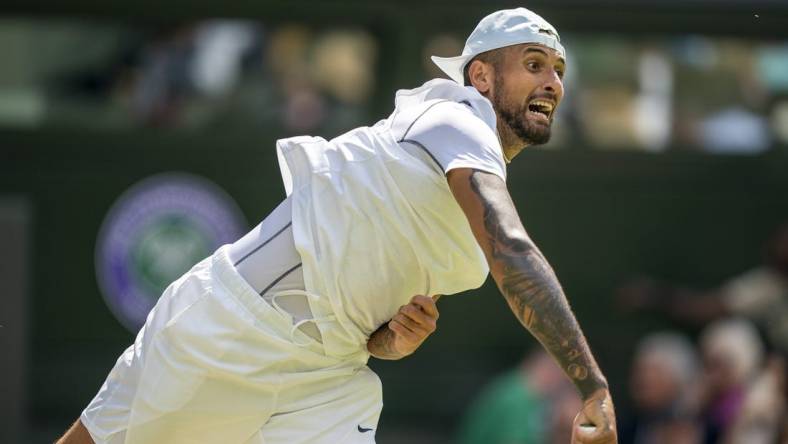 Jul 4, 2022; London, United Kingdom; Nick Kyrgios (AUS) serves during his match against Brandon Nakashima (USA) on day eight at All England Lawn Tennis and Croquet Club. Mandatory Credit: Susan Mullane-USA TODAY Sports