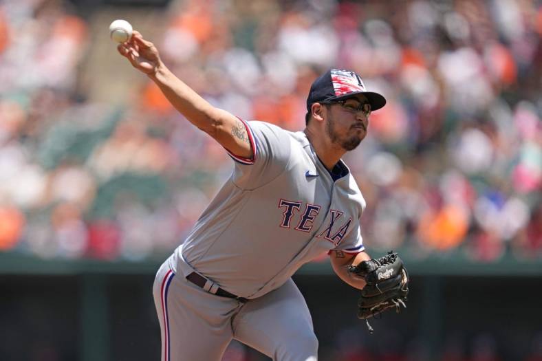Jul 4, 2022; Baltimore, Maryland, USA; Texas Rangers pitcher Dane Dunning (33) delivers in the first inning against the Baltimore Orioles at Oriole Park at Camden Yards. Mandatory Credit: Mitch Stringer-USA TODAY Sports