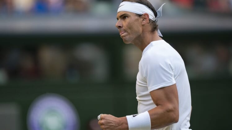 Jul 4, 2022; London, United Kingdom; Rafael Nadal (ESP) reacts to a point during his match against Botic Van De Zandschulp (NED) on day eight at All England Lawn Tennis and Croquet Club. Mandatory Credit: Susan Mullane-USA TODAY Sports
