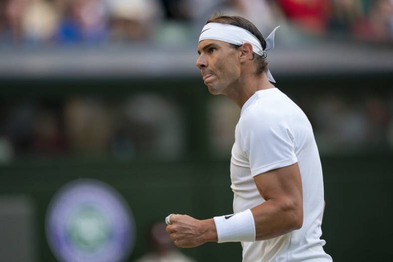 Jul 4, 2022; London, United Kingdom; Rafael Nadal (ESP) reacts to a point during his match against Botic Van De Zandschulp (NED) on day eight at All England Lawn Tennis and Croquet Club. Mandatory Credit: Susan Mullane-USA TODAY Sports