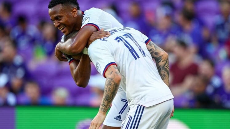 Jul 4, 2022; Orlando, Florida, USA; D.C. United forward Taxiarchis Fountas (11) is congratulated by forward Michael Estrada (7) after scoring his second goal against Orlando City in the first half at Exploria Stadium. Mandatory Credit: Nathan Ray Seebeck-USA TODAY Sports
