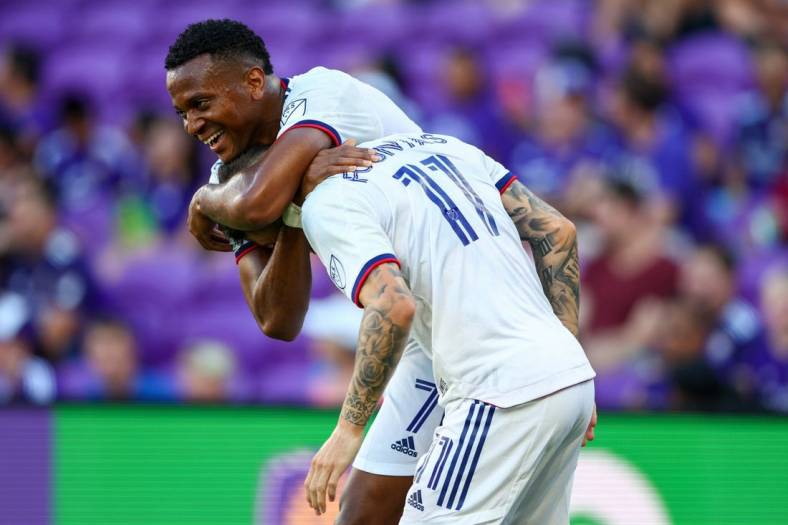 Jul 4, 2022; Orlando, Florida, USA; D.C. United forward Taxiarchis Fountas (11) is congratulated by forward Michael Estrada (7) after scoring his second goal against Orlando City in the first half at Exploria Stadium. Mandatory Credit: Nathan Ray Seebeck-USA TODAY Sports