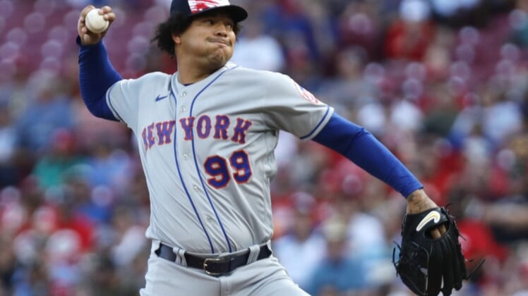 Jul 4, 2022; Cincinnati, Ohio, USA; New York Mets starting pitcher Taijuan Walker (99) throws a pitch against the Cincinnati Reds during the first inning at Great American Ball Park. Mandatory Credit: David Kohl-USA TODAY Sports