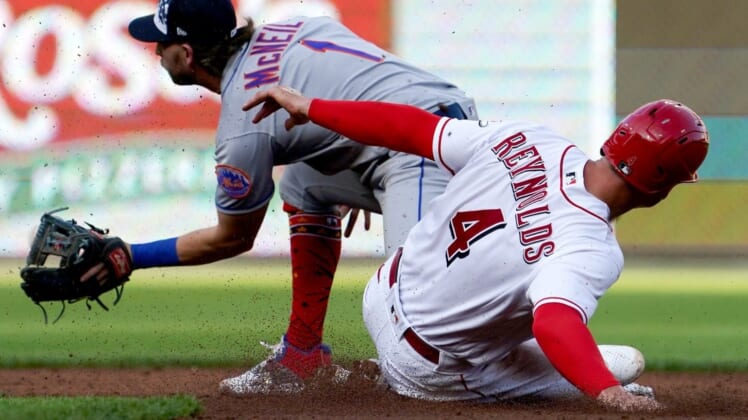 Cincinnati Reds shortstop Matt Reynolds (4) slides safely to second base during the third inning of a baseball game against the New York Mets, Monday, July 4, 2022, at Great American Ball Park in Cincinnati.New York Mets At Cincinnati Reds July 1 0028