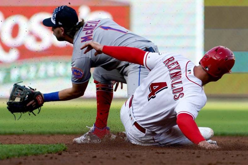 Cincinnati Reds shortstop Matt Reynolds (4) slides safely to second base during the third inning of a baseball game against the New York Mets, Monday, July 4, 2022, at Great American Ball Park in Cincinnati.

New York Mets At Cincinnati Reds July 1 0028
