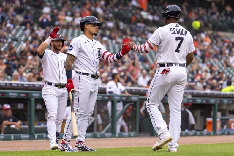 Jul 4, 2022; Detroit, Michigan, USA; Detroit Tigers second baseman Jonathan Schoop (7) celebrates with shortstop Javier Baez (middle) and left fielder Robbie Grossman (left) after scoring a run during the third inning against the Cleveland Guardians at Comerica Park. Mandatory Credit: Raj Mehta-USA TODAY Sports