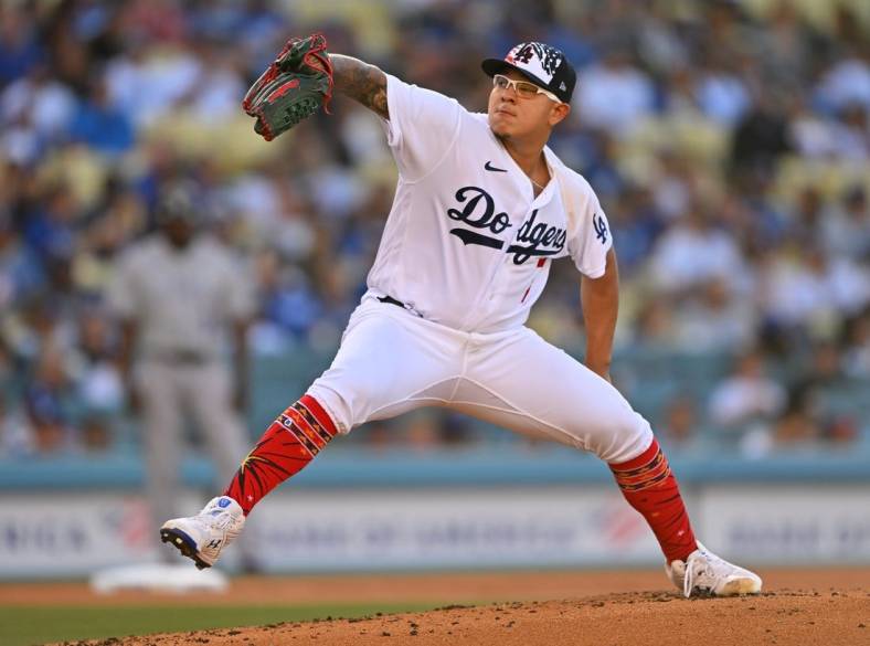 Jul 4, 2022; Los Angeles, California, USA; Los Angeles Dodgers starting pitcher Julio Urias (7) throws to the plate in the second inning of the game against the Colorado Rockies at Dodger Stadium. Mandatory Credit: Jayne Kamin-Oncea-USA TODAY Sports