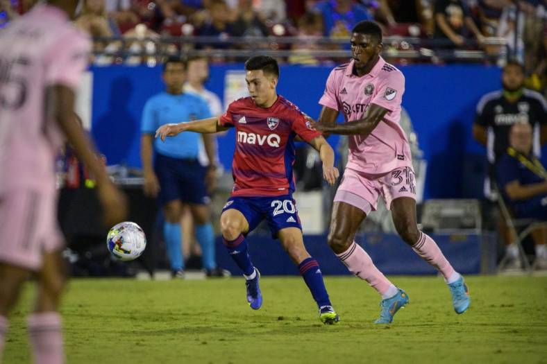 Jul 4, 2022; Frisco, Texas, USA; FC Dallas forward Alan Velasco (20) and Inter Miami defender Damion Lowe (31) look for the ball during the first half at Toyota Stadium. Mandatory Credit: Jerome Miron-USA TODAY Sports