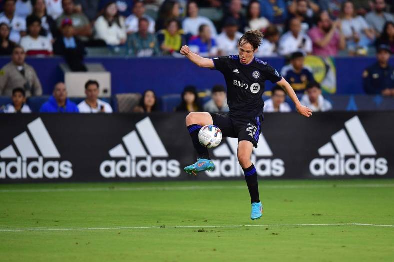 Jul 4, 2022; Carson, California, USA; CF Montreal midfielder Lassi Lappalainen (21) controls the ball against Los Angeles Galaxy during the first half at Dignity Health Sports Park. Mandatory Credit: Gary A. Vasquez-USA TODAY Sports