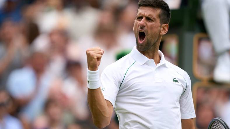 Jul 5, 2022; London, England, United Kingdom; Novak Djokovic (SRB) celebrates after match point against Jannik Sinner (ITA) during a quarterfinals mens singles match on Centre court at the 2022 Wimbledon Championships at All England Lawn Tennis and Croquet Club. Mandatory Credit: Peter van den Berg-USA TODAY Sports