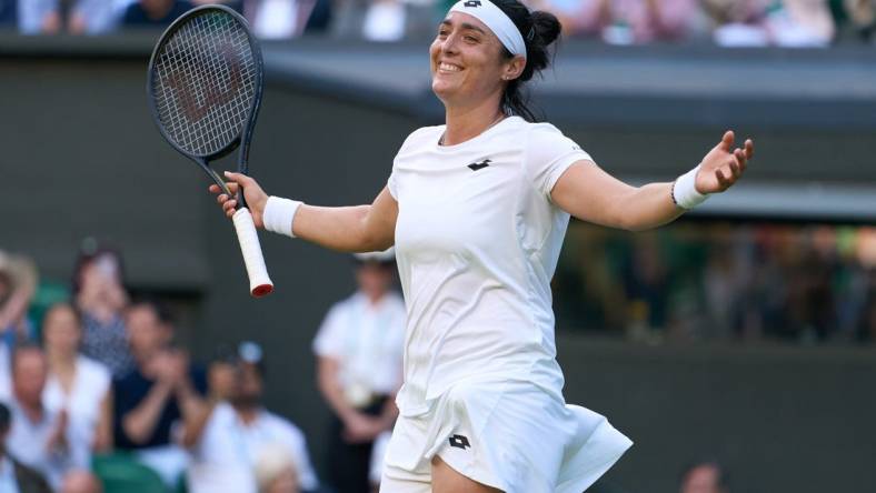 Jul 5, 2022; London, England, United Kingdom; Ons Jabeur (TUN) celebrates after match point in a quarterfinals womens singles match against Mane Bouzkova (CZE) on Centre court at the 2022 Wimbledon Championships at All England Lawn Tennis and Croquet Club. Mandatory Credit: Peter van den Berg-USA TODAY Sports