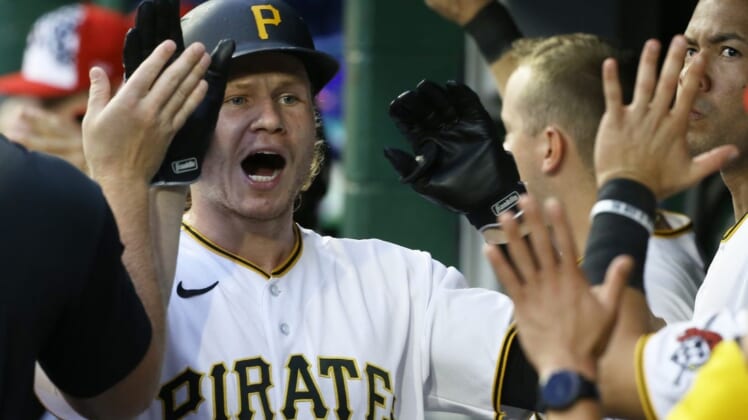 Jul 5, 2022; Pittsburgh, Pennsylvania, USA;  Pittsburgh Pirates right fielder Jack Suwinski (65) high-fives in the Pirates dugout after hitting a two run home run against the New York Yankees during the fourth inning at PNC Park. Mandatory Credit: Charles LeClaire-USA TODAY Sports