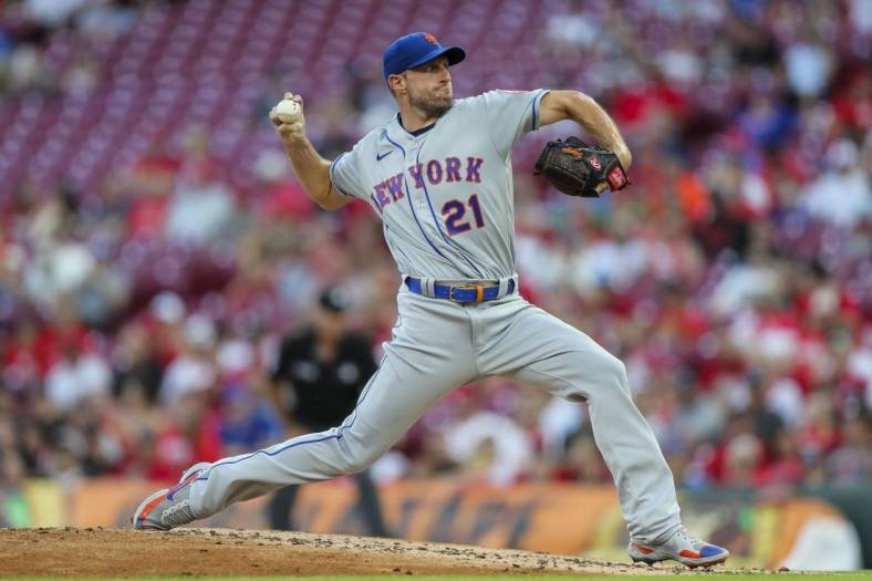 Jul 5, 2022; Cincinnati, Ohio, USA; New York Mets starting pitcher Max Scherzer (21) pitches during the second inning against the Cincinnati Reds at Great American Ball Park. Mandatory Credit: Katie Stratman-USA TODAY Sports