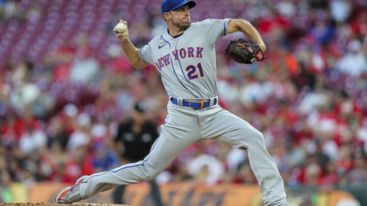 Jul 5, 2022; Cincinnati, Ohio, USA; New York Mets starting pitcher Max Scherzer (21) pitches during the second inning against the Cincinnati Reds at Great American Ball Park. Mandatory Credit: Katie Stratman-USA TODAY Sports