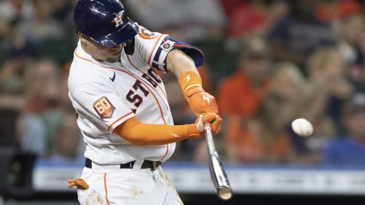 Jul 5, 2022; Houston, Texas, USA;  Houston Astros first baseman Aledmys Diaz (16) hits a single against the Kansas City Royals in the second inning at Minute Maid Park. Mandatory Credit: Thomas Shea-USA TODAY Sports