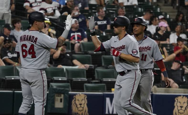 Jul 5, 2022; Chicago, Illinois, USA; Minnesota Twins left fielder Alex Kirilloff (19) is greeted by third baseman Jose Miranda (64) after hitting a two run home run against the Chicago White Sox during the seventh inning at Guaranteed Rate Field. Mandatory Credit: David Banks-USA TODAY Sports