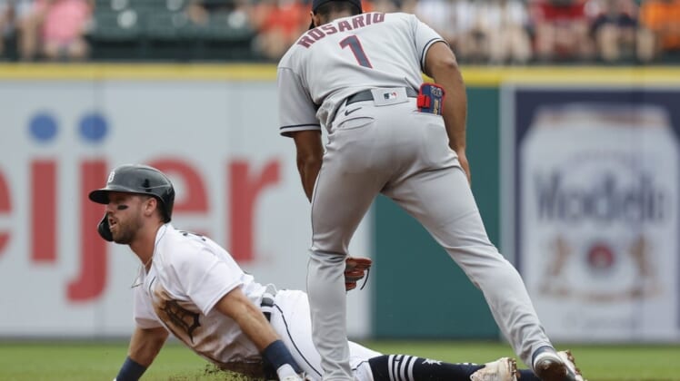 Jul 6, 2022; Detroit, Michigan, USA; Detroit Tigers third baseman Kody Clemens (21) slides safely at second under the tag by Cleveland Guardians shortstop Amed Rosario (1) during second inning at Comerica Park. Mandatory Credit: Rick Osentoski-USA TODAY Sports