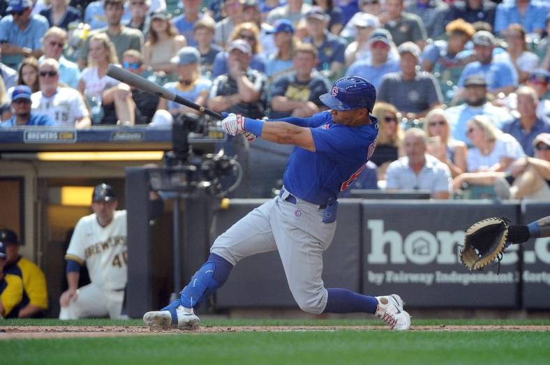 Jul 6, 2022; Milwaukee, Wisconsin, USA; Chicago Cubs center fielder Rafael Ortega (66) hits a one-run RBI single in the eighth inning against the Milwaukee Brewers at American Family Field. Mandatory Credit: Michael McLoone-USA TODAY Sports