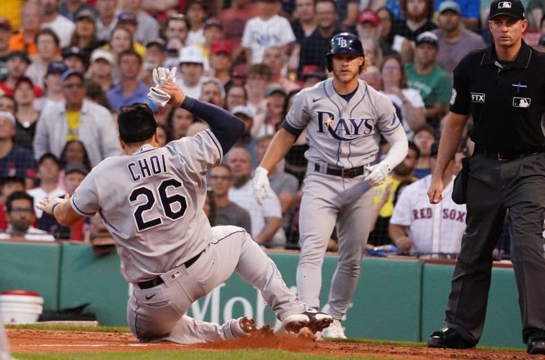 Jul 6, 2022; Boston, Massachusetts, USA; Tampa Bay Rays first baseman Ji-Man Choi (26) slides into home plate to score against the Boston Red Sox in the third inning at Fenway Park. Mandatory Credit: David Butler II-USA TODAY Sports