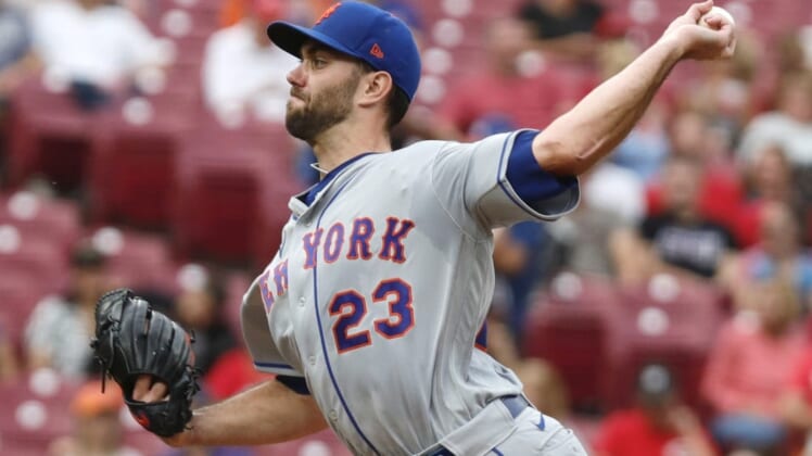 Jul 6, 2022; Cincinnati, Ohio, USA; New York Mets starting pitcher David Peterson (23) throws a pitch against the Cincinnati Reds during the first inning at Great American Ball Park. Mandatory Credit: David Kohl-USA TODAY Sports