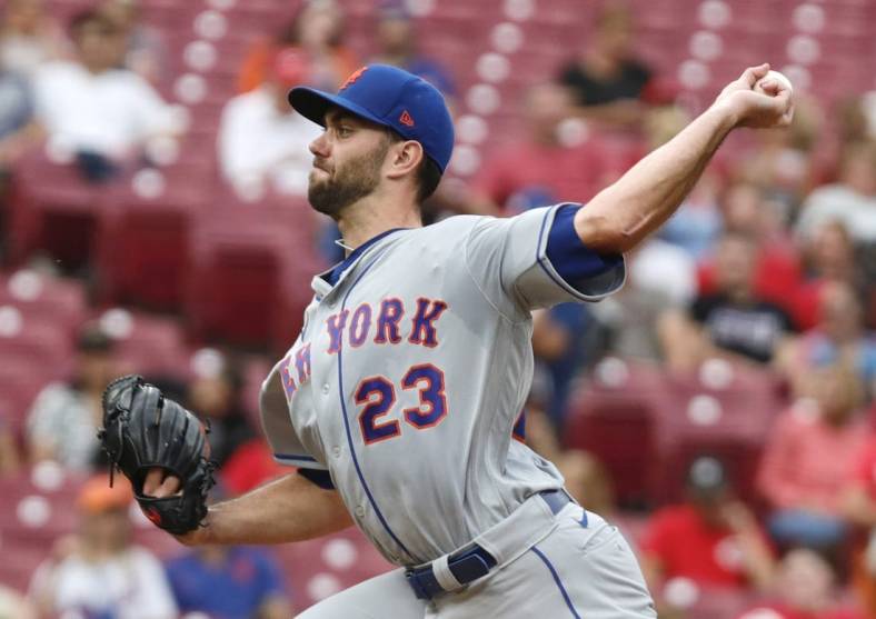 Jul 6, 2022; Cincinnati, Ohio, USA; New York Mets starting pitcher David Peterson (23) throws a pitch against the Cincinnati Reds during the first inning at Great American Ball Park. Mandatory Credit: David Kohl-USA TODAY Sports