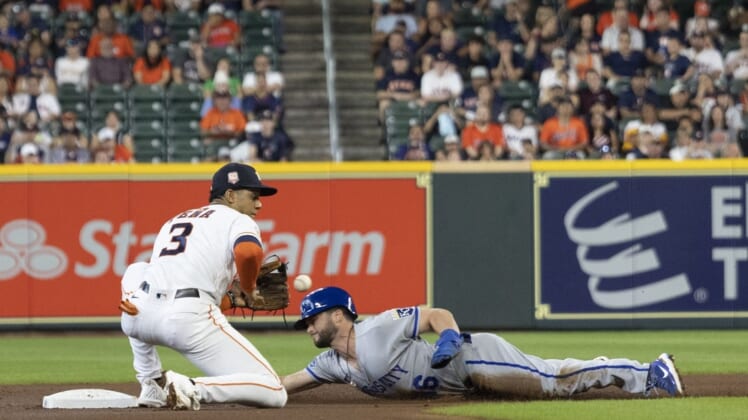 Jul 6, 2022; Houston, Texas, USA; Kansas City Royals left fielder Andrew Benintendi (16) steals second base against Houston Astros shortstop Jeremy Pena (3) in the first inning at Minute Maid Park. Mandatory Credit: Thomas Shea-USA TODAY Sports
