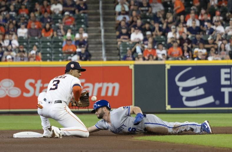 Jul 6, 2022; Houston, Texas, USA; Kansas City Royals left fielder Andrew Benintendi (16) steals second base against Houston Astros shortstop Jeremy Pena (3) in the first inning at Minute Maid Park. Mandatory Credit: Thomas Shea-USA TODAY Sports