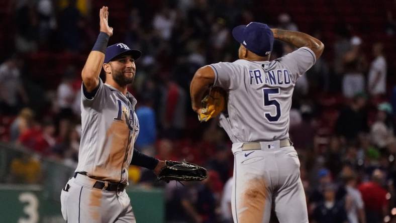 Jul 6, 2022; Boston, Massachusetts, USA; Tampa Bay Rays center fielder Kevin Kiermaier (39), and shortstop Wander Franco (5) react after defeating the Boston Red Sox in nine innings at Fenway Park. Mandatory Credit: David Butler II-USA TODAY Sports