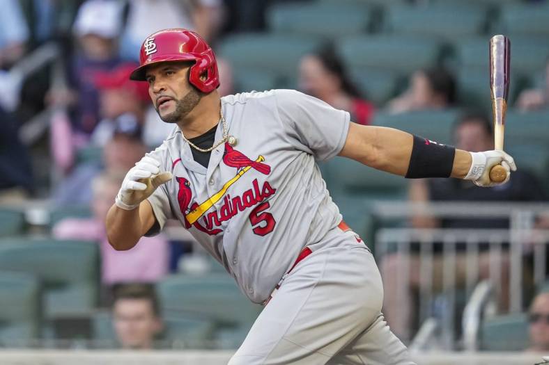 Jul 6, 2022; Cumberland, Georgia, USA;  St. Louis Cardinals designated hitter Albert Pujols (5) hits a double against the Atlanta Braves during the fourth inning at Truist Park. Mandatory Credit: Dale Zanine-USA TODAY Sports