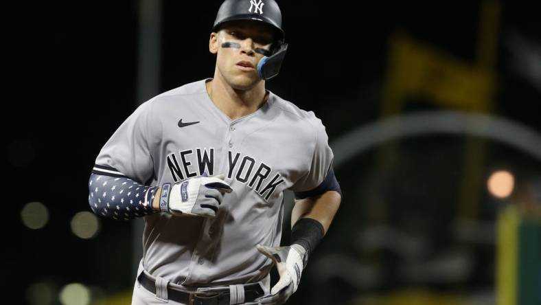 Jul 6, 2022; Pittsburgh, Pennsylvania, USA; New York Yankees center fielder Aaron Judge (99) rounds the bases after hitting a grand slam home run against the Pittsburgh Pirates during the eighth inning at PNC Park. Mandatory Credit: Charles LeClaire-USA TODAY Sports