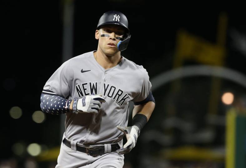 Jul 6, 2022; Pittsburgh, Pennsylvania, USA; New York Yankees center fielder Aaron Judge (99) rounds the bases after hitting a grand slam home run against the Pittsburgh Pirates during the eighth inning at PNC Park. Mandatory Credit: Charles LeClaire-USA TODAY Sports