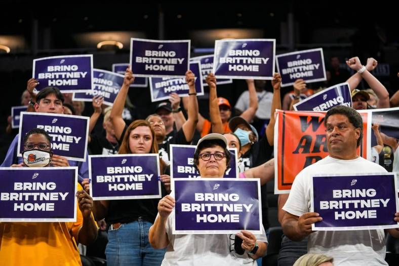 Attendees lift up their signs during a rally for Brittney Griner's release at the Footprint Center on July 6, 2022, in Phoenix.

Dsc04342