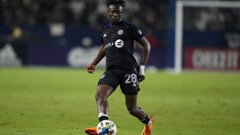 Jul 4, 2022; Carson, California, USA; CF Montreal midfielder Ismael Kone (28) passes the ball against the LA Galaxy in the second half at Dignity Health Sports Park. Mandatory Credit: Kirby Lee-USA TODAY Sports