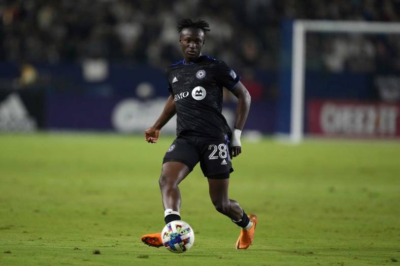 Jul 4, 2022; Carson, California, USA; CF Montreal midfielder Ismael Kone (28) passes the ball against the LA Galaxy in the second half at Dignity Health Sports Park. Mandatory Credit: Kirby Lee-USA TODAY Sports
