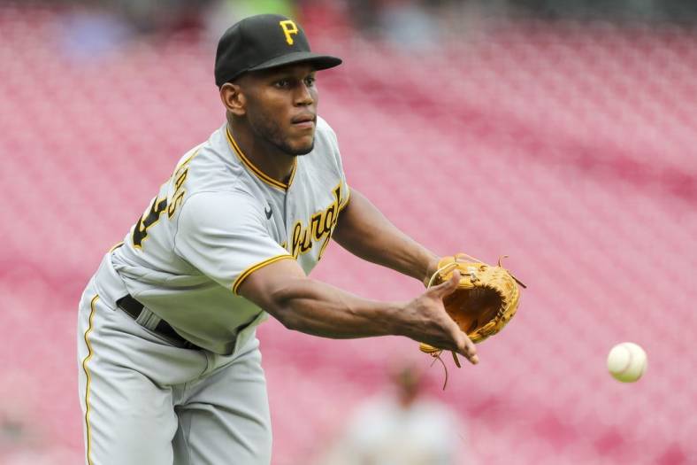 Jul 7, 2022; Cincinnati, Ohio, USA; Pittsburgh Pirates starting pitcher Roansy Contreras (59) throws to first to get Cincinnati Reds second baseman Jonathan India (not pictured) out in the first inning at Great American Ball Park. Mandatory Credit: Katie Stratman-USA TODAY Sports