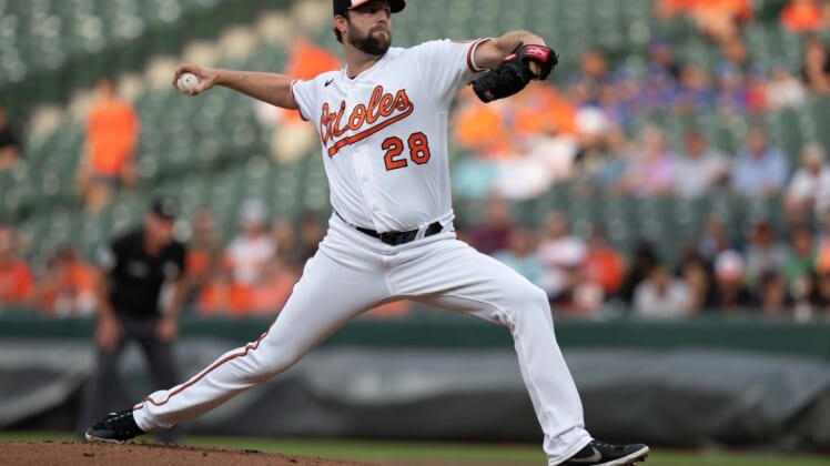 Jul 7, 2022; Baltimore, Maryland, USA;  Baltimore Orioles starting pitcher Jordan Lyles (28) pitches against the Los Angeles Angels during the first inning at Oriole Park at Camden Yards. Mandatory Credit: Jessica Rapfogel-USA TODAY Sports
