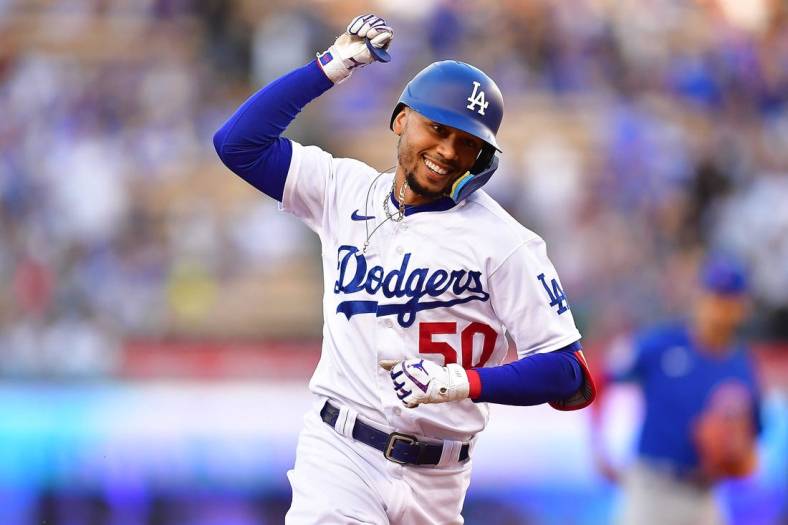 Jul 7, 2022; Los Angeles, California, USA; Los Angeles Dodgers right fielder Mookie Betts (50) runs the bases after hitting a solo home run against the Chicago Cubs during the first inning at Dodger Stadium. Mandatory Credit: Gary A. Vasquez-USA TODAY Sports