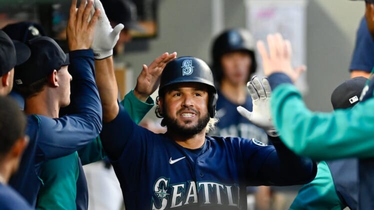Jul 7, 2022; Seattle, Washington, USA; Seattle Mariners third baseman Eugenio Suarez (28) celebrates in the dugout after hitting a home run against the Toronto Blue Jays during the fifth inning at T-Mobile Park. Mandatory Credit: Steven Bisig-USA TODAY Sports