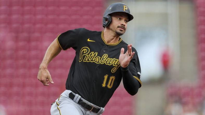 Jul 7, 2022; Cincinnati, Ohio, USA; Pittsburgh Pirates center fielder Bryan Reynolds (10) runs to third on a double hit by designated hitter Daniel Vogelbach (not pictured) in the first inning against against the Cincinnati Reds at Great American Ball Park. Mandatory Credit: Katie Stratman-USA TODAY Sports