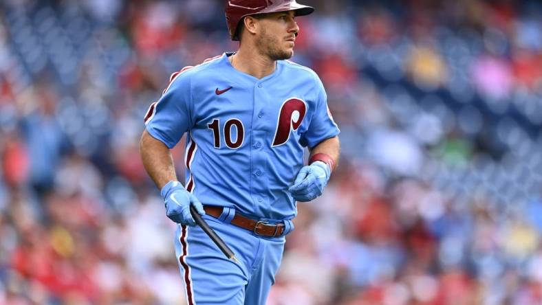 Jul 7, 2022; Philadelphia, Pennsylvania, USA; Philadelphia Phillies catcher JT Realmuto (10) carries a piece of his bat as he advances to first on a single against the Washington Nationals in the fifth inning at Citizens Bank Park. Mandatory Credit: Kyle Ross-USA TODAY Sports