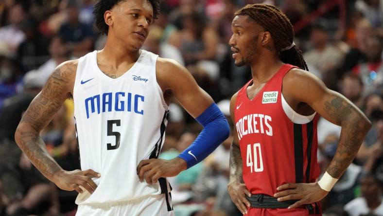 Jul 7, 2022; Las Vegas, NV, USA; Orlando Magic forward Paolo Banchero (5) talks to Houston Rockets forward Trhae Mitchell (40) during an NBA Summer League game at T&M. Mandatory Credit: Stephen R. Sylvanie-USA TODAY Sports