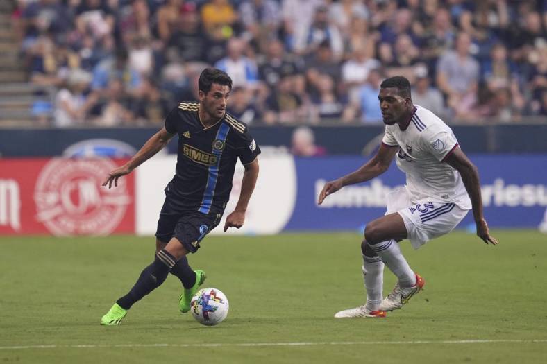 Jul 8, 2022; Chester, Pennsylvania, USA; Philadelphia Union forward Julian Carranza (9) controls the ball against D.C. United defender Donovan Pines (23) in the first half at Subaru Park. Mandatory Credit: Mitchell Leff-USA TODAY Sports