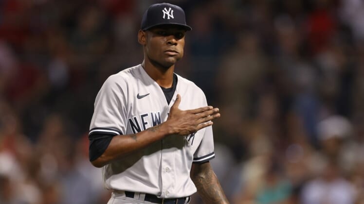 Jul 8, 2022; Boston, Massachusetts, USA; New York Yankees relief pitcher Miguel Castro (30) reacts during the fourth inning against the Boston Red Sox at Fenway Park. Mandatory Credit: Paul Rutherford-USA TODAY Sports
