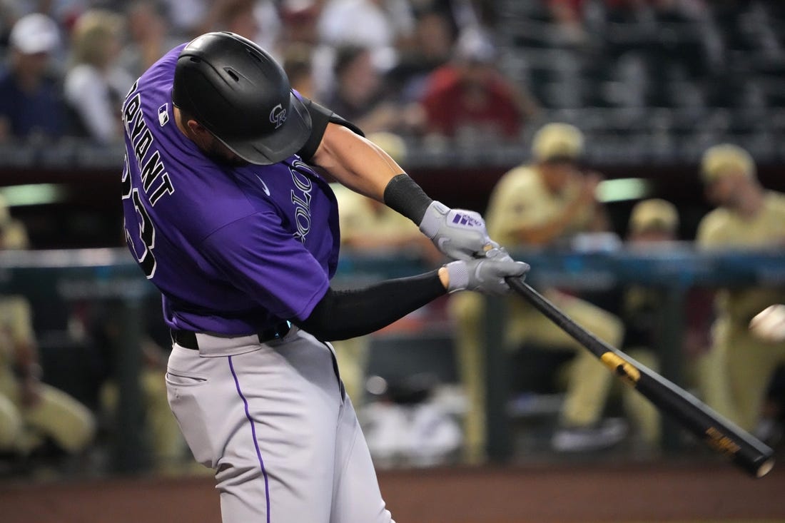 Jul 8, 2022; Phoenix, Arizona, USA; Colorado Rockies left fielder Kris Bryant (23) hits a solo home run against the Arizona Diamondbacks during the first inning at Chase Field. Mandatory Credit: Joe Camporeale-USA TODAY Sports