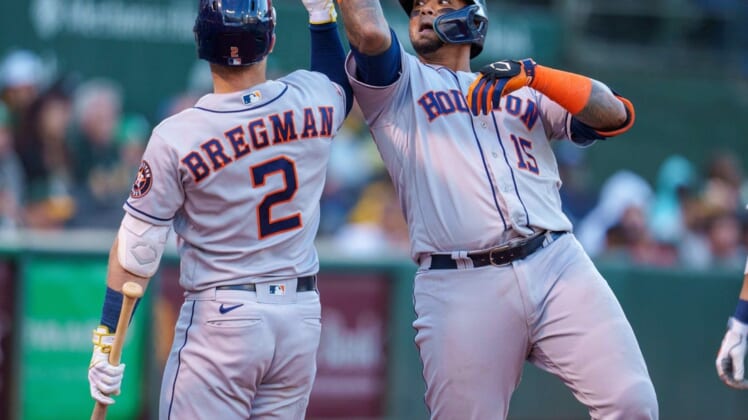 Jul 8, 2022; Oakland, California, USA;  Houston Astros catcher Martin Maldonado (15) celebrates with third baseman Alex Bregman (2) after hitting a home run against the Oakland Athletics during the fifth inning at RingCentral Coliseum. Mandatory Credit: Neville E. Guard-USA TODAY Sports
